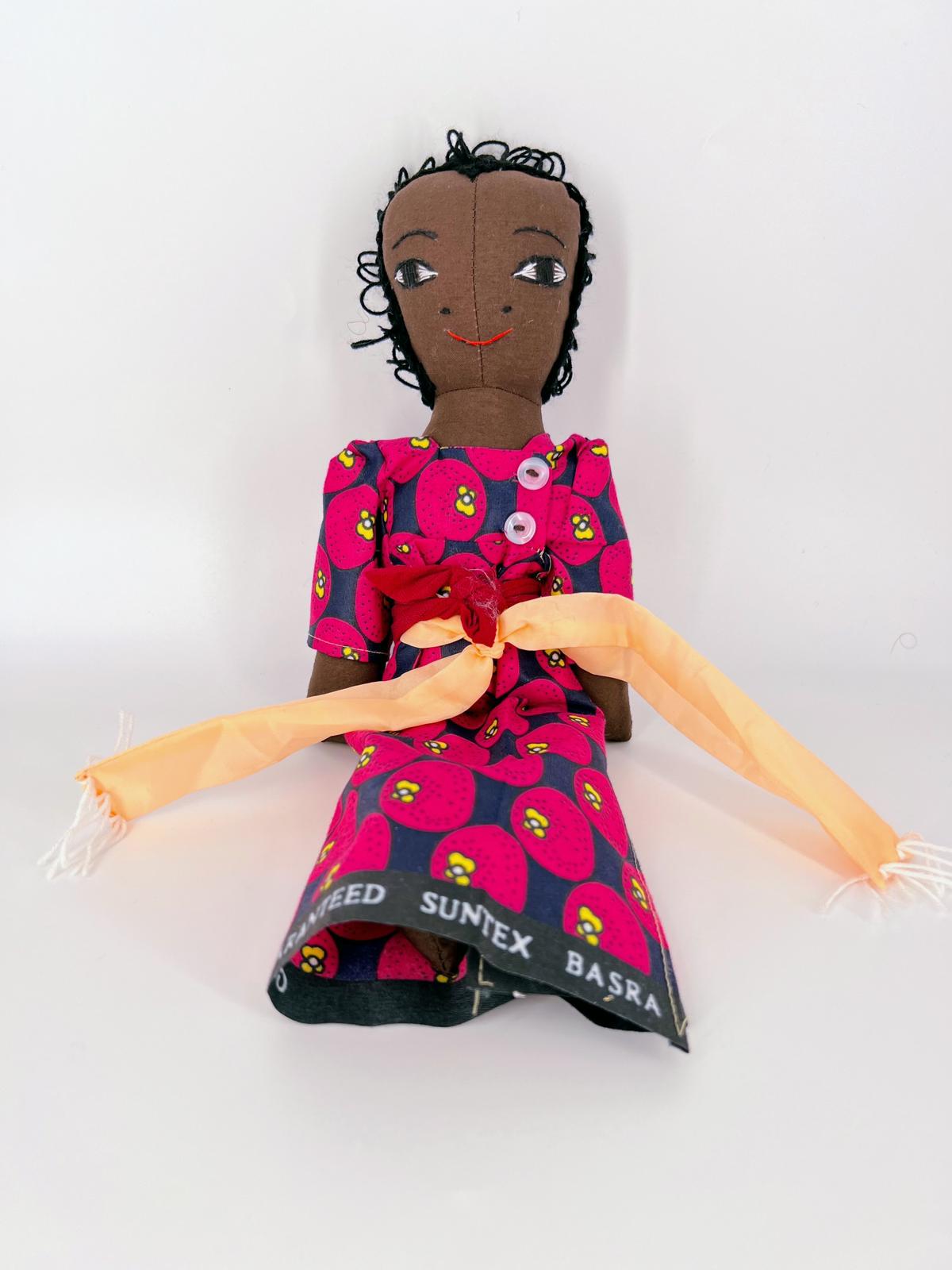 African Doll wearing a gomesi dress - Image 3